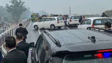 PM Modi's cavalcade wait on a flyover after protesters blocked the highway. 