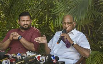 NCP Chief Sharad Pawar addresses the media with party leader Mohammed Faizal Padippura