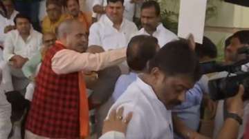 High drama outside Bihar Assembly, BJP MLA throws laddus offered by RJD leaders | WATCH