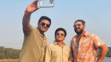 Former Indian team cricketers Anil Kumble (L), Sachin Tendulkar and Yuvraj Singh (R).