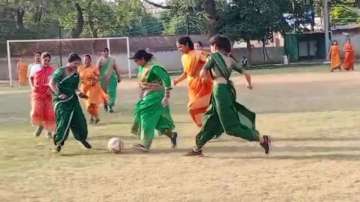 Women wearing sarees play football match in Gwalior