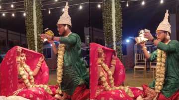 Wedding photographer clicks pictures of bride in his own wedding