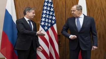 US Secretary of State Antony Blinken, left, greets Russian Foreign Minister Sergey Lavrov before their meeting, in Geneva, Switzerland.