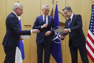 NATO Secretary General Jens Stoltenberg, centre, Finnish Foreign Minister Pekka Haavisto, left, and United States Secretary of State Antony Blinken.