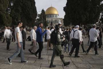 Israeli police escort Jewish visitors marking the holiday pf Passover to the Al-Aqsa Mosque compound.