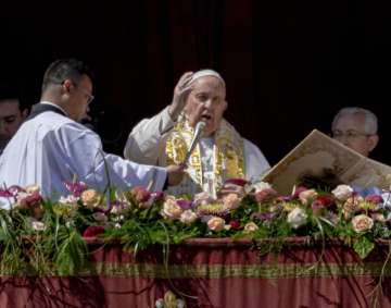 Pope Francis bestows the plenary 'Urbi et Orbi' (to the city and to the world) blessing from the central lodge of the St. Peter's Basilica at The Vatican.