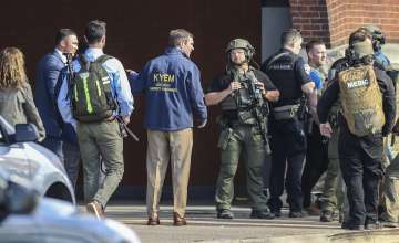 Multiple agencies arrive at a building after a shooting took place in Louisville.