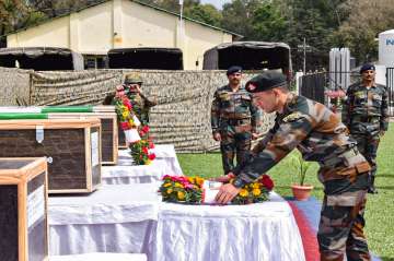 Poonch: Security personnel lay a wreath near the mortal remains of 5 soldiers who were killed in a terrorist attack in Poonch district