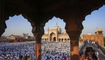 Muslims offer Eid-al-Fitr Prayers to mark the end of their holy fasting month of Ramadan at Jama Masjid