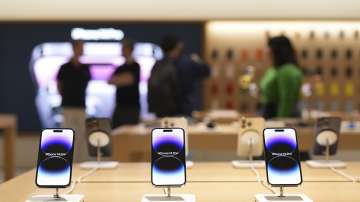 Apple mobile phones on display at the Apple retail store at Saket, during a media preview ahead of its opening, in New Delhi