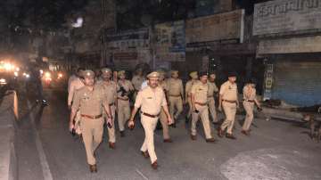 Police personnel patrol an area after the imposition of Section 144 in Uttar Pradesh in view of the killing of mafioso-turned-politician Atiq Ahmed and his brother Khalid Azim aka Ashraf.