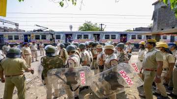 Security personnel deployed near Rishra railway station amid tension after clashes broke out between two groups during a Ram Navami procession on Sunday, in Hooghly district, West Bengal