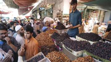 People visit a market to buy Dates and other items in a Karachi market in Pakistan
