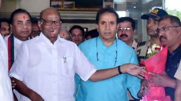 Nationalist Congress Party (NCP) President Sharad Pawar with former Mharashtra home minister Anil Deshmikh at Nagpur Airport, in Nagpur. 