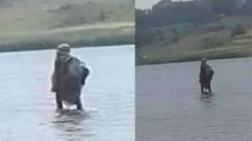 Woman walking on Narmada River in MP