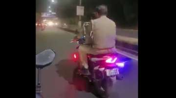 UP cops fined for riding without wearing helmet.