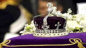  The Koh-i-noor, or "mountain of light," diamond, set in the Maltese Cross at the front of the crown made for Britain's late Queen Mother Elizabeth, is seen on her coffin as it is drawn to London's Westminster Hall