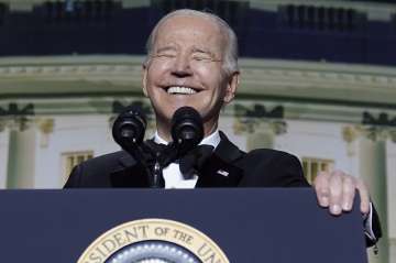 President Joe Biden laughs as he speaks during the White House Correspondents' Association dinner at the Washington Hilton in Washington.