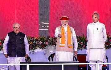Prime Minister Narendra Modi with Rajasthan Governor Kalraj Mishra and Chief Minister Ashok Gehlot during a programme to lay foundation stone and dedicate various projects, in Nathdwara