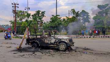 Charred remains of a vehicle that was set ablaze after violence broke out during the Tribal Solidarity March called by All Tribal Student Union Manipur (ATSUM), in Imphal.
