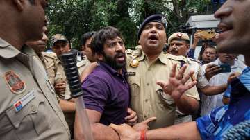 Police detain wrestler Bajrang Punia during wrestlers' protest against Wrestling Federation of India (WFI) chief Brij Bhushan Sharan Singh.