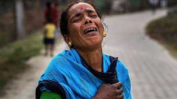 Radha Rani Mondal, 50, wails after her son was arrested by police in the Morigaon district in a child marriage case.