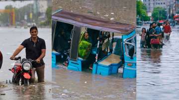 People wade through a flooded road after heavy rainfalls in Pakistan