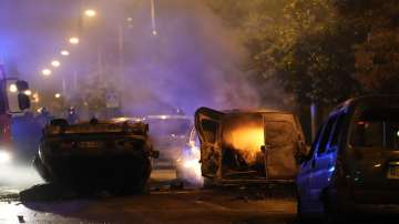 Cars overturned during violent protests in Paris suburb of Nanterre following the fatal police shooting of a delivery driver.