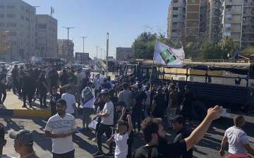 The protesters included followers of the political leader and Shiite cleric Muqtada al-Sadr.