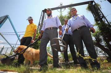 Security personnel stand guard ahead of the Amarnath Yatra at Bhagwati Nagar Yatri Niwas base camp in Jammu