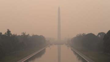 The Washington Monument in a thick layer of smoke in Washington. 