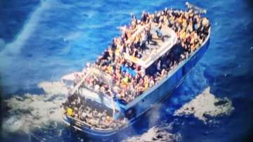  This undated handout imageshows scores of people covering practically every free stretch of the deck on a battered fishing boat that later capsized and sank off southern Greece