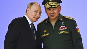 Russia's President Vladimir Putin and Russian Defense Minister Sergei Shoigu attend the opening of the Army 2022 International Military.