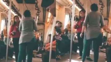 Women pick up shoes and bottle to fight in Delhi Metro