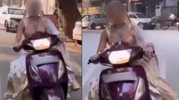 Bride rides scooty without helmet