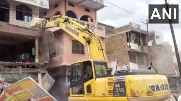 Bulldozer razes residence of accused in Fatehpur who raped, murdered girl 5 days ago | VIDEO