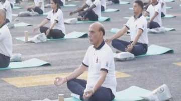 Rajnath Singh performs Yoga on INS Vikrant