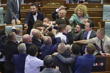 Lawmakers push each other as a brawl breaks out in Kosovo's parliament in Pristina, Kosovo