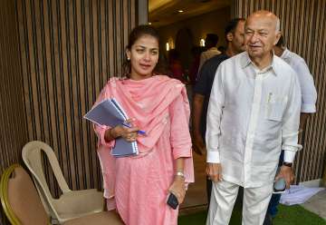 Senior Congress leader Sushil Kumar Shinde with his daughter and party leader Praniti Shinde