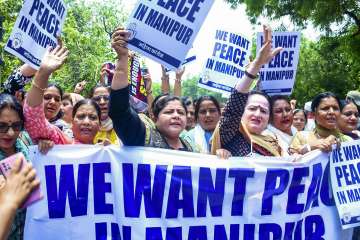 Mahila Congress President Netta DSouza with workers raises slogans during a protest over Manipur violence