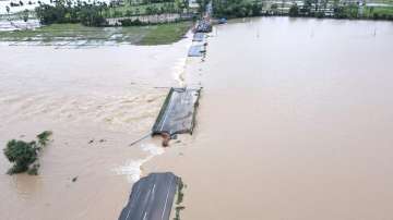 An aerial view of a partially damaged road submerged in the floodwaters of the swollen Godavari River, in Bhupalpally district