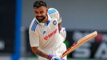 Virat Kohli celebrates his Test hundred at Port of Spain