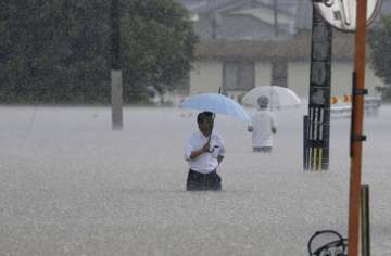 Two people died as heavy rains lash Japan.