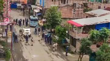 Security forces personnel guard after a mob allegedly attempted to loot weapons from an India Reserve Battalion located in Khangabok, in Thoubal district of Manipur.