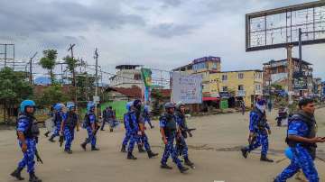 Security personnel patrol a violence-hit area in Manipur.