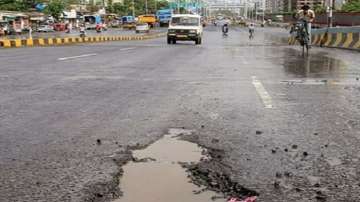 Mumbai's problems of potholes has been exacerbated by heavy rains.