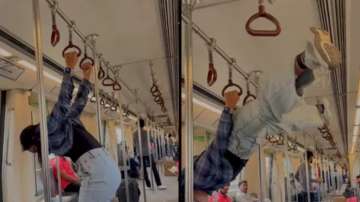 Woman doing acrobatics in Delhi Metro