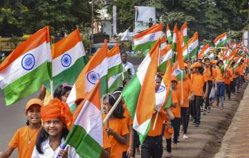 School students take part in a 'Tiranga Rally' on the eve of the Independence Day in Maharashtra.