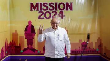 Gujarat Chief Minister Bhupendra Patel shows victory sign as he arrives to attend BJPs Core Committee meeting ahead of 2024 general elections, in Ahmedabad (File photo)