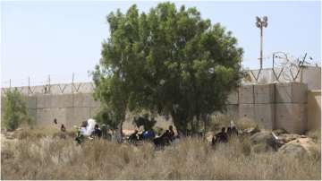 Migrants at a desert area near Tunisia-Libya border